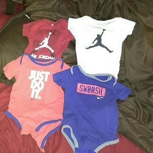 Set of 4 Nike and Jordan onesies